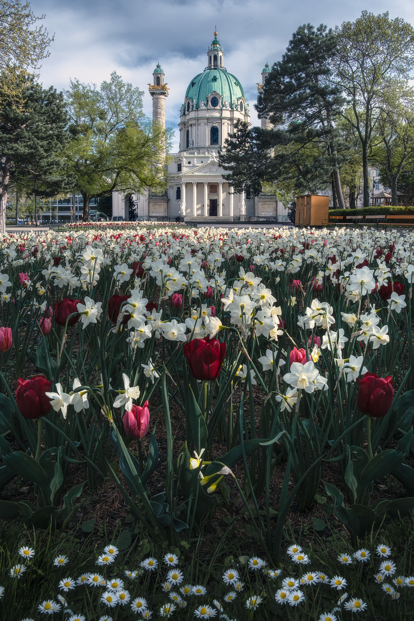 Karlskirche framed by tulips and spring flowers in Vienna